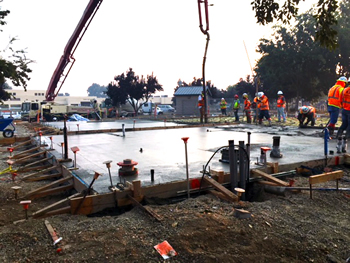 The concrete for the foundation slab for the new Empire Library being poured.